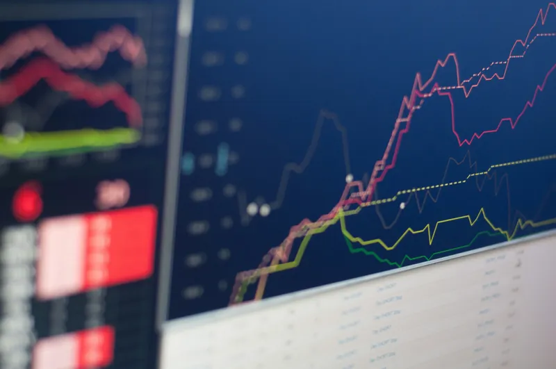 Multiple rising strategy performance lines on a stock trading screen